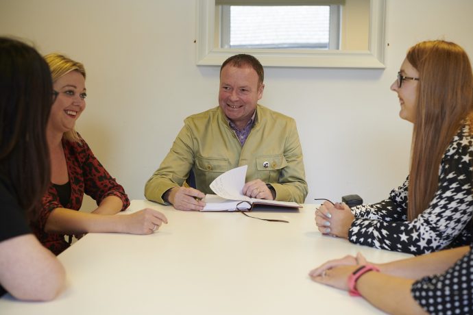 Trainer and delegates in training room